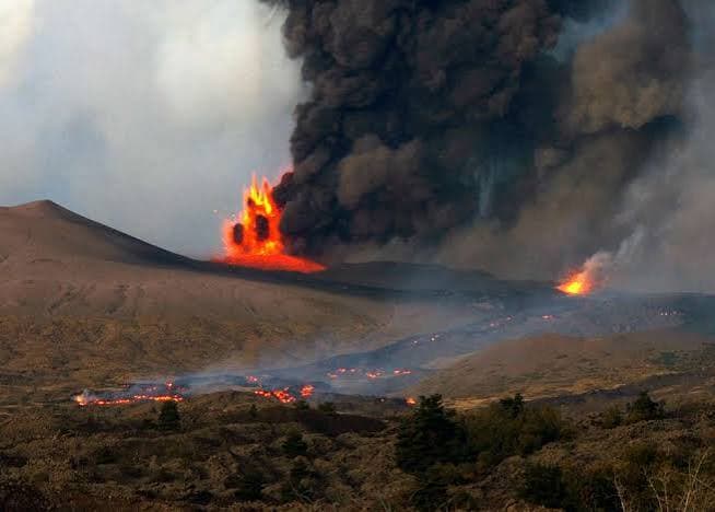 Mt. Etna eruptions - A large plume of black smoke… — PICRYL - Public Domain Media Search Engine